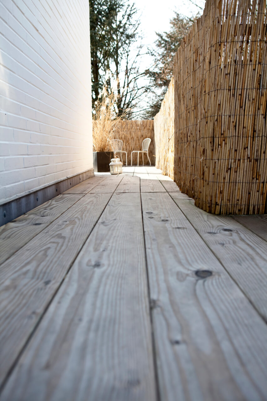 Wooden terrace beside a residential home